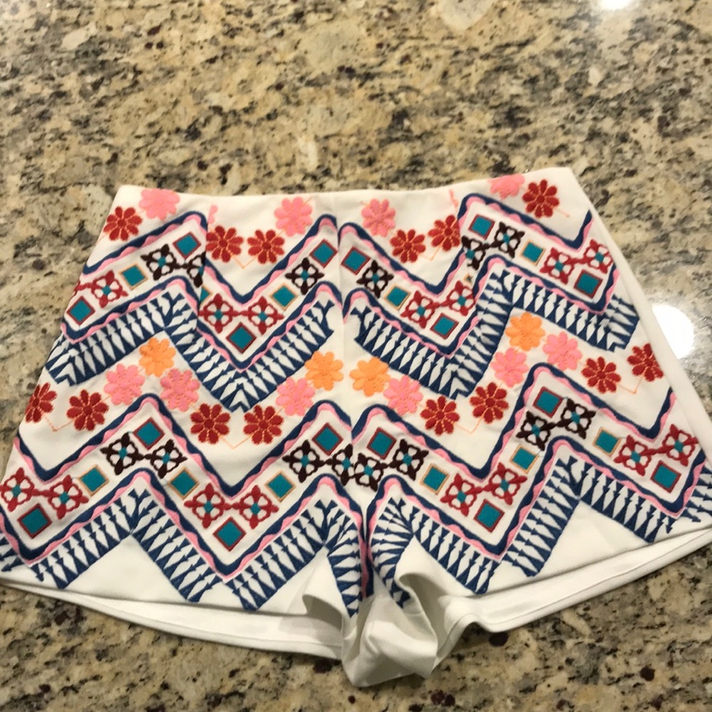 High waisted white shorts with floral design